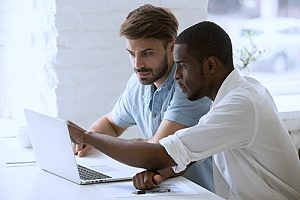 an employee and his boss working together to find out which retirement plan will work for him